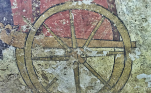 A detail of the Tomb of the Infernal Quadriga showing the wheel of the carriage